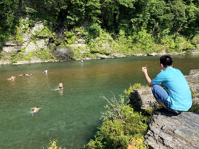 Nobody can read signboards saying don't swim here.